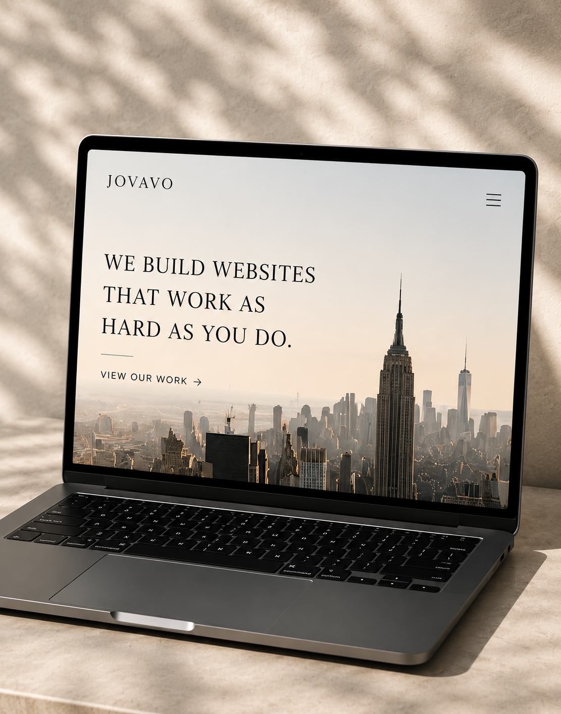Jovavo website design on laptop